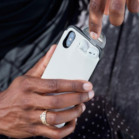 Phone Case With Airpods Holder in hand, showing AirPods securely stored, highlighting convenience and tech functionality.